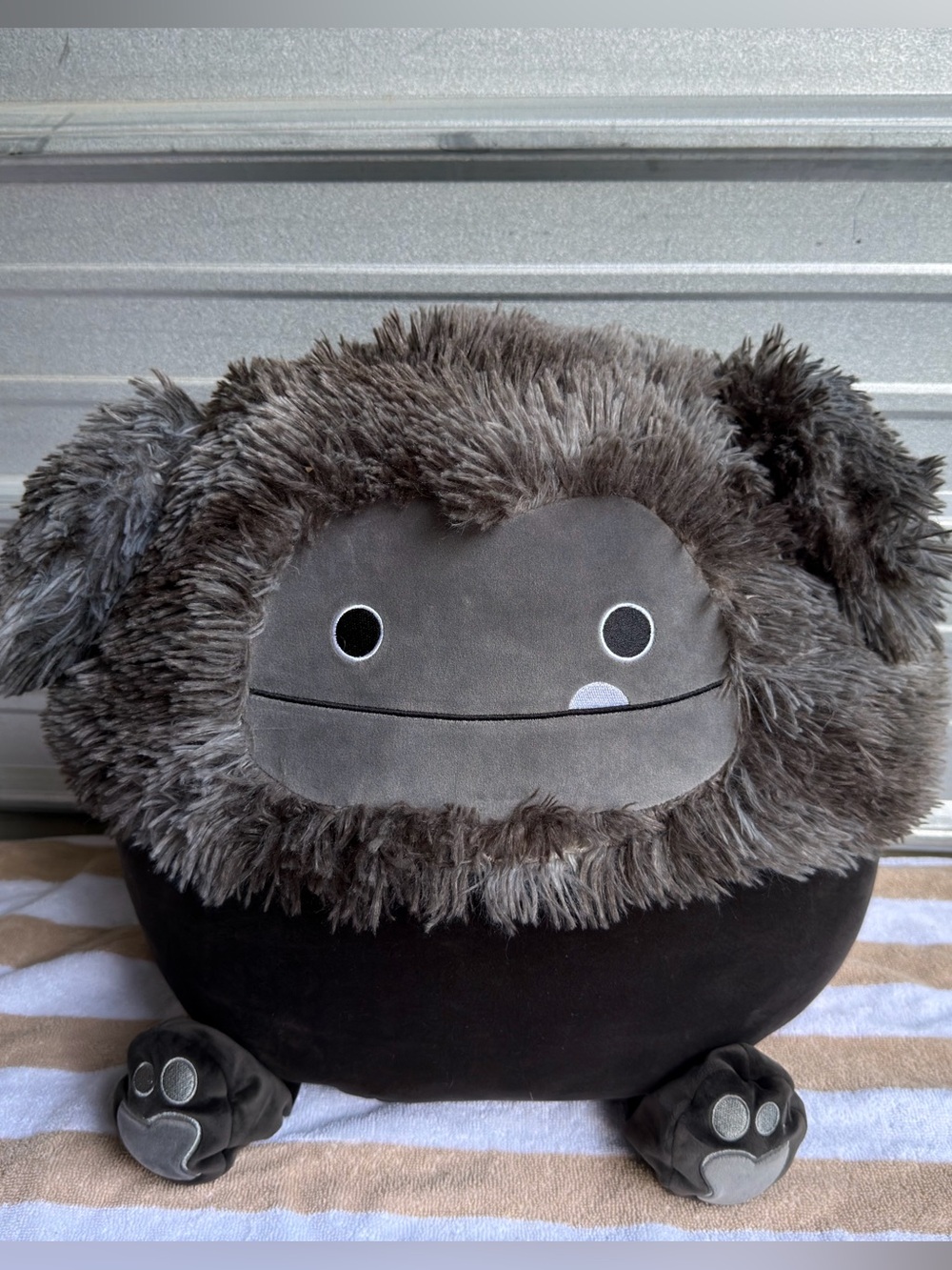Squishmallows Wallis Black Bigfoot plush is a 16-inch
